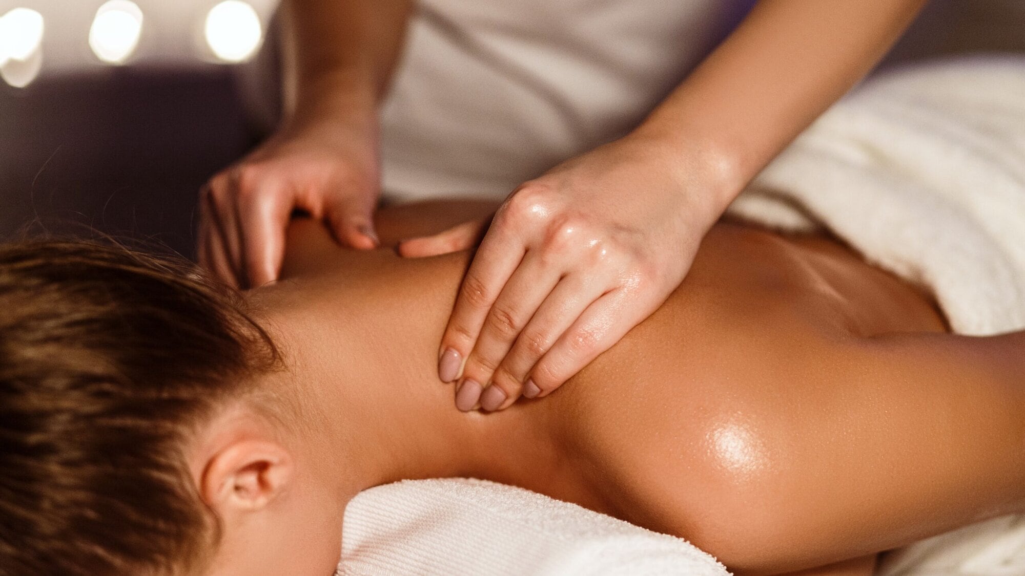 A serene massage therapy session in progress, highlighting the calming atmosphere.